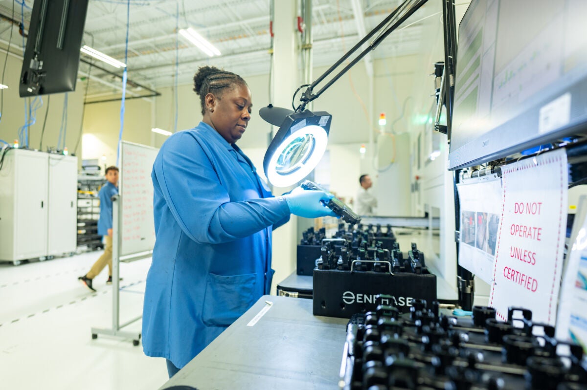 Flex employee on Enphase production line