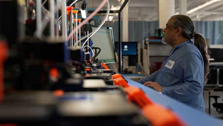 Image of assembly line with person working