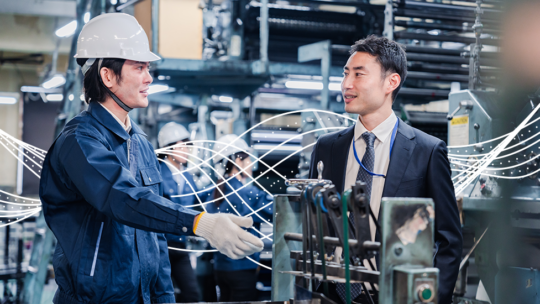 Two men talking sustainable supplier business on the shop floor