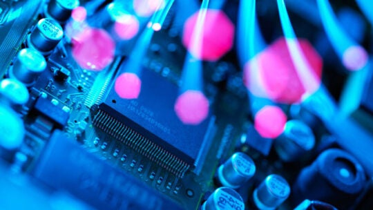 Fibre optics carrying data passing across electronic circuit board