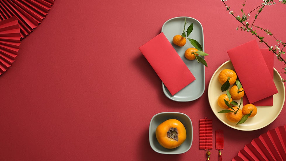 table setting with red tablecloth and napkins in honor of the Year of the Rabbit